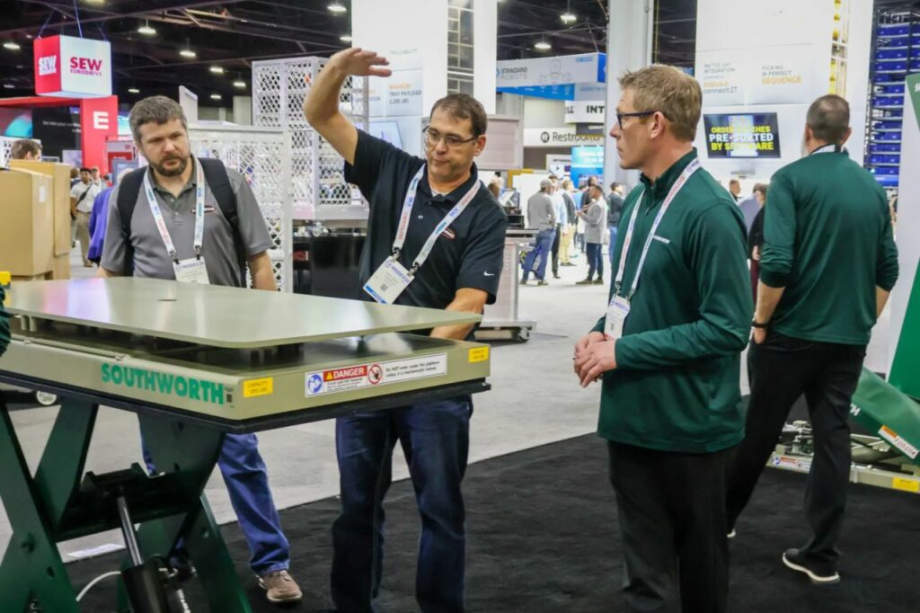 On the show floor: Southworth's team demonstrates a hydraulic lift table at MODEX 2026, Georgia World Congress Center. (alt: Southworth lift table demonstration at MODEX 2026) Photo credit: Southworth